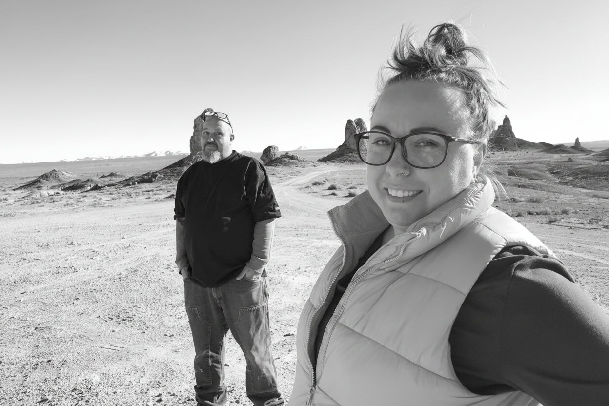 matt olney and kristy olney from Olney Ranch standing in a desert landscape with clear blue sky